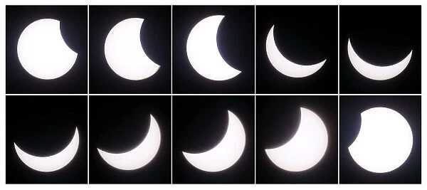 A combination of photographs shows a partial solar eclipse seen in Berlin