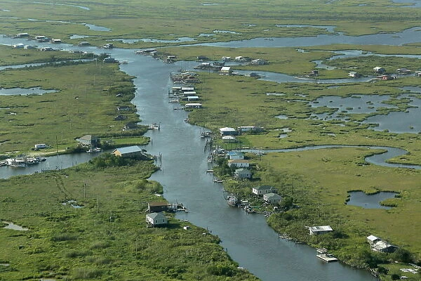 Communities are seen surrounded by water and wetlands in Plaquemines Parish, Louisiana