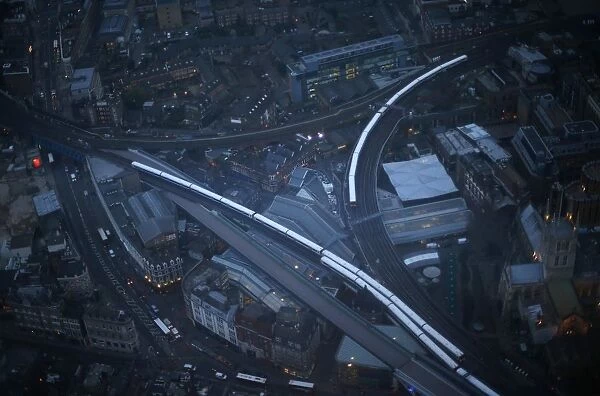Commuter trains are seen at dusk in an aerial photograph from The View gallery at the Shard