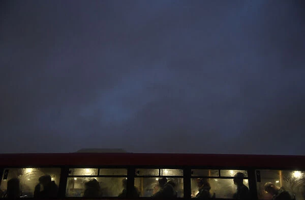 Commuters ride a bus over Westminster Bridge during a strike on the Underground by