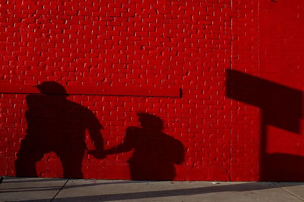 A couple casts a shadow on the wall during the South by Southwest Music Film Interactive