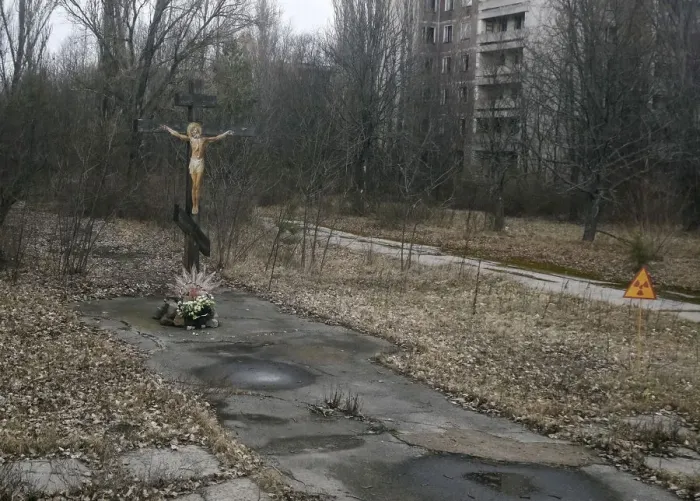 Framed Print : A cross with a crucifix is seen in the deserted town of Pripyat Framed Print : A cross with a crucifix is seen in the deserted town of Pripyat