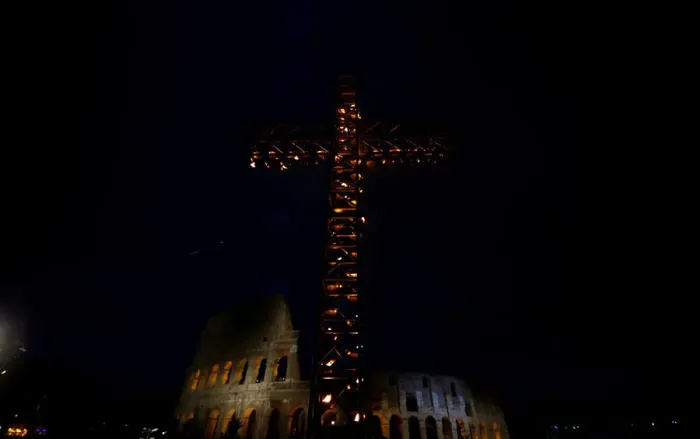Framed Print : A cross lit up with candles is seen in front of the Colosseum before the Via Crucis