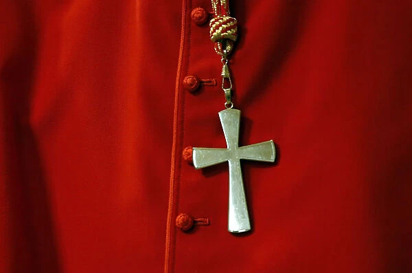A cross is seen on a Cardinal cassock during a mass in St