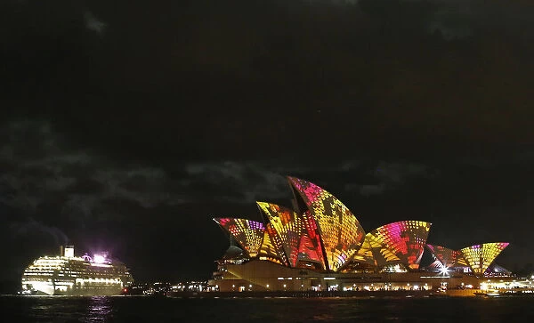 A cruise ship navigates past the Sydney Opera House as Play by The Spinifex Group