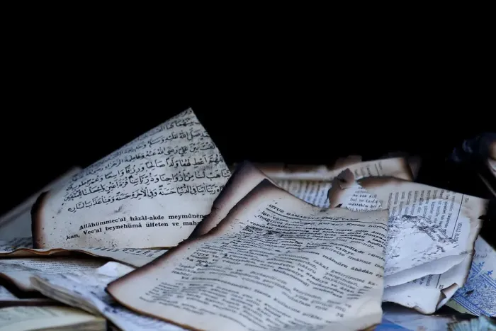 Framed Print : Damaged books are pictured in a mosque after it was destroyed by a fire in Berlin