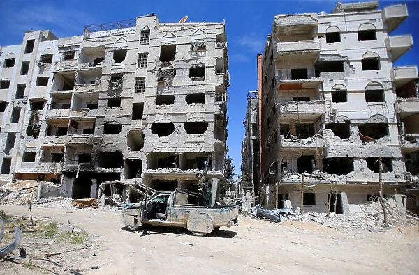 A damaged buildings are seen in the city of Douma, Damascus