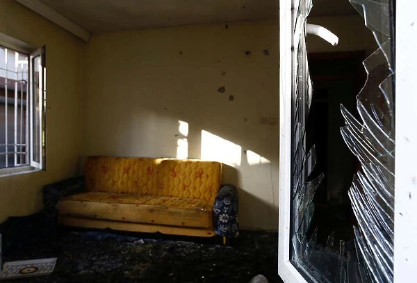 A damaged house is seen after a suspected suicide bomber targeted a wedding celebration