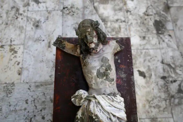 Framed Print : A damaged statue of Jesus Christ that was recovered from rubbles is placed in a church in Framed Print : A damaged statue of Jesus Christ that was recovered from rubbles is placed in a church in