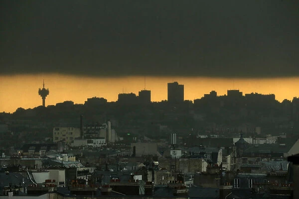 Dark clouds gather in a general view of the Eastern Paris sky line