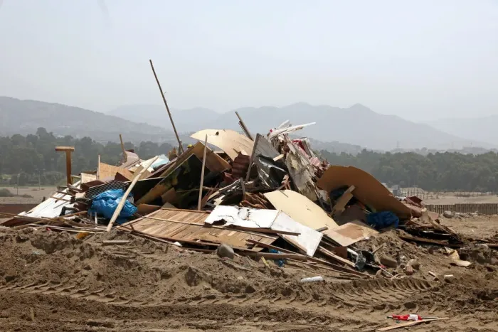 Framed Print : Debris of huts are seen after police evict squatters from a land in Villa El Salvador Framed Print : Debris of huts are seen after police evict squatters from a land in Villa El Salvador