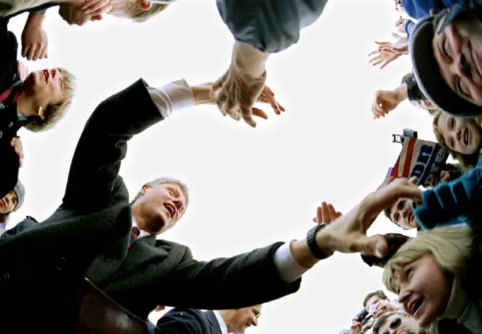 Framed Print : Democratic presidential candidate Bill Clinton reaches into the crowd during a campaign