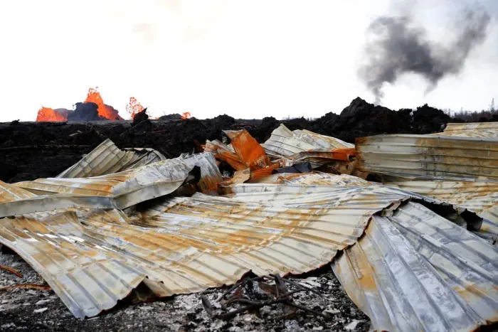 Framed Print : A destroyed structure is seen as lava pours out of a fissure Framed Print : A destroyed structure is seen as lava pours out of a fissure