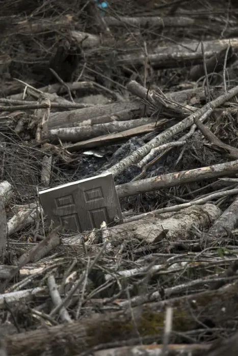 Framed Print : A door is seen trapped amidst a debris field left by a mudslide in Oso Framed Print : A door is seen trapped amidst a debris field left by a mudslide in Oso