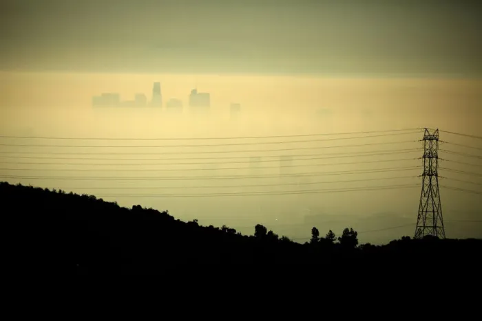 Framed Print : Downtown Los Angeles is seen behind an electricity pylon through the morning marine layer Framed Print : Downtown Los Angeles is seen behind an electricity pylon through the morning marine layer