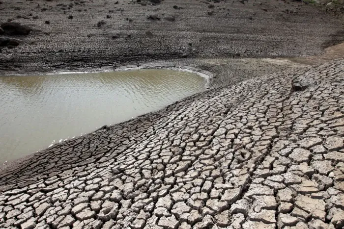 Framed Print : Dried mud is seen during a low-level period of water in Concepcion reservoir on Framed Print : Dried mud is seen during a low-level period of water in Concepcion reservoir on