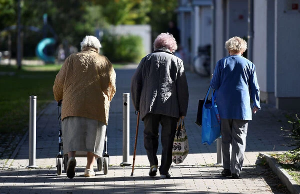 Elderly women walk on a sidewalk in the Pius quarter in Ingolstadt