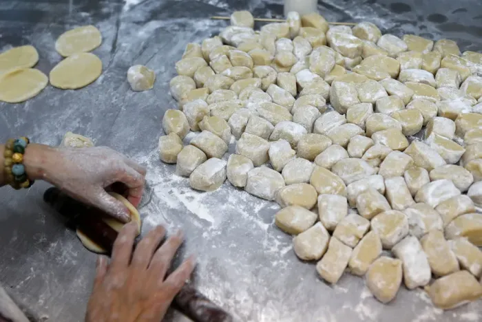 Framed Print : An employee makes mooncakes with anti-extradition bill slogans at Wah Yee Tang Bakery in Framed Print : An employee makes mooncakes with anti-extradition bill slogans at Wah Yee Tang Bakery in