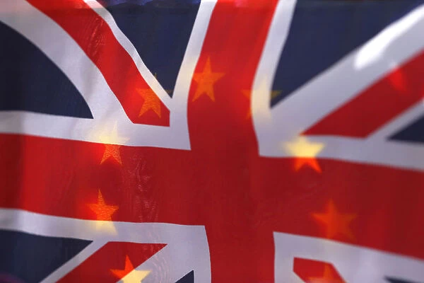 An EU flag is seen through a British Union flag during a pro-EU referendum event at