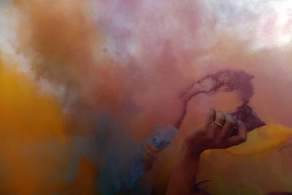 Festival goers throw powder at a colour party during Budapests Sziget music festival