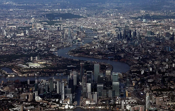 FILE PHOTO: Canary Wharf and the City of London financial district are seen from an