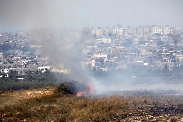 A fire burns in scrubland in Israel near the Gaza Strip