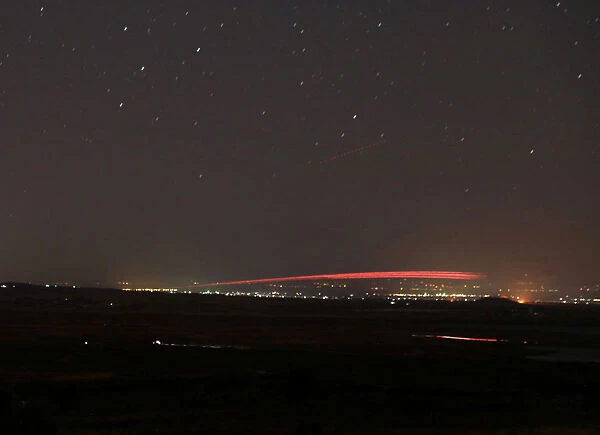 Fire from fighting is seen from Quneitra
