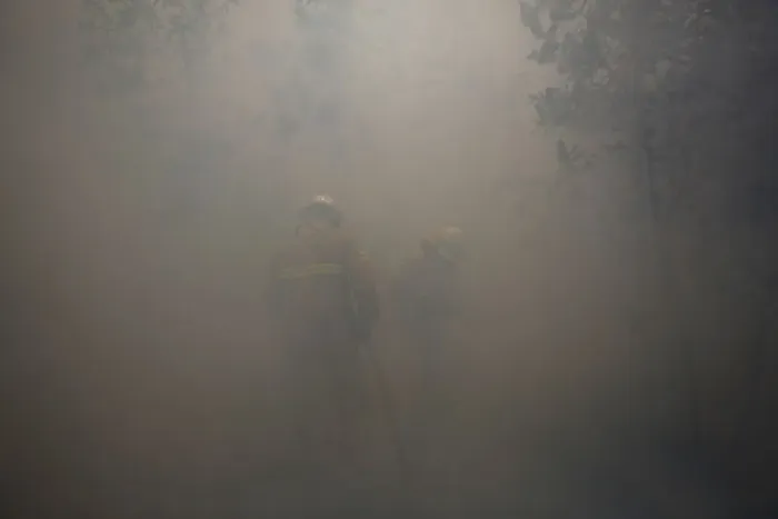 Framed Print : Firefighters work amidst smoke to put out a forest fire near Castanheira de Pera Framed Print : Firefighters work amidst smoke to put out a forest fire near Castanheira de Pera