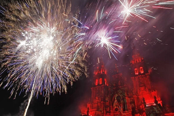Fireworks explode over an ancient cathedral in Santiago de Compostela during celebrations