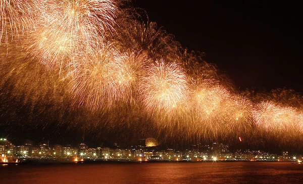 Fireworks explode above Copacabana beach in Rio de Janeiro