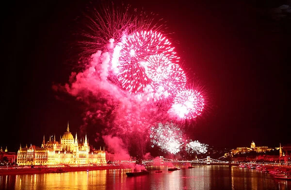 Fireworks explode over Danube River during Saint Stephens Day in Budapest