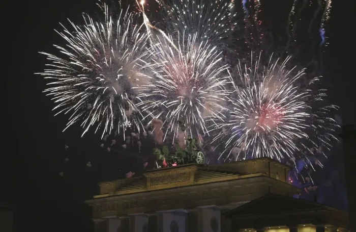Framed Print : Fireworks explode next to the Quadriga sculpture atop the Brandenburg gate during Framed Print : Fireworks explode next to the Quadriga sculpture atop the Brandenburg gate during