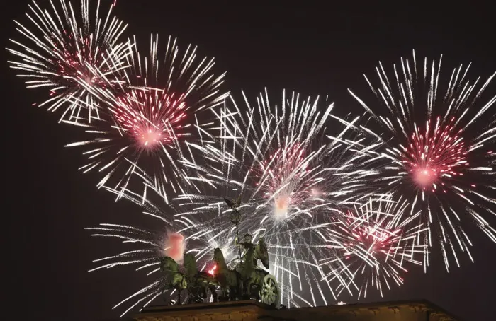 Framed Print : Fireworks explode next to the Quadriga sculpture atop the Brandenburg gate during Framed Print : Fireworks explode next to the Quadriga sculpture atop the Brandenburg gate during