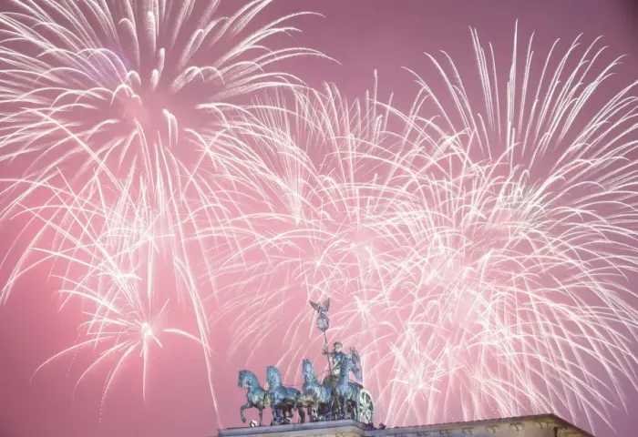 Framed Print : Fireworks explode next to the Quadriga sculpture atop the Brandenburg gate during New Framed Print : Fireworks explode next to the Quadriga sculpture atop the Brandenburg gate during New