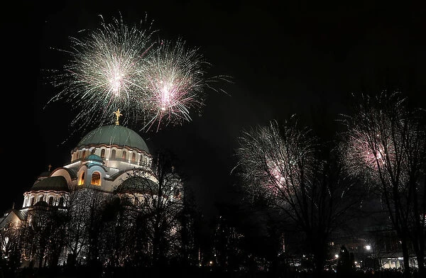 Fireworks explode over the St. Sava temple during the Orthodox Christian New Years Day