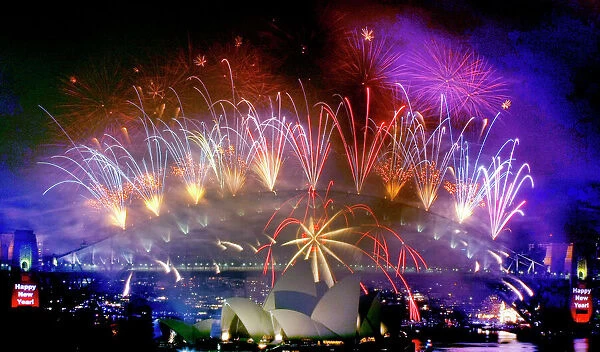 Fireworks explode over the Sydney Harbour Bridge and Opera House