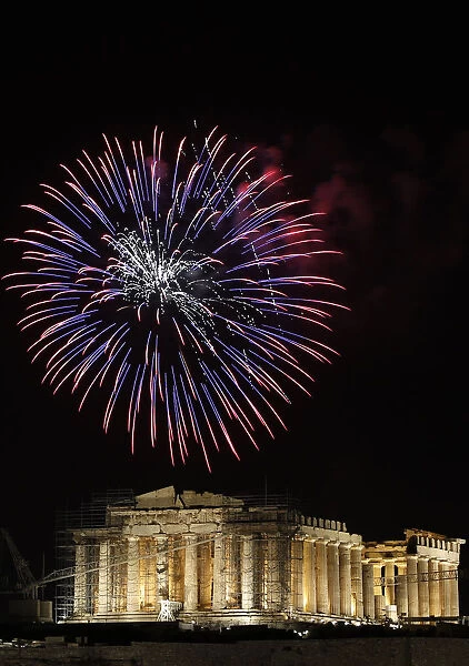 Fireworks explode over the temple of the Parthenon during New Years day celebrations in