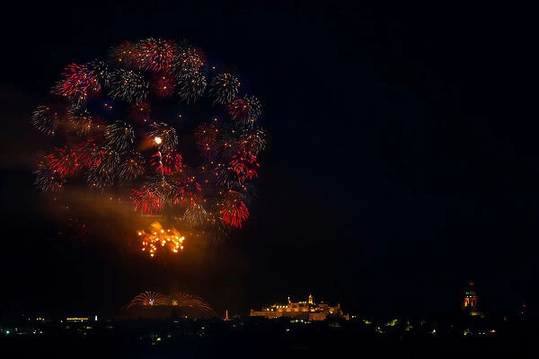Fireworks explode over the town of Victoria on the Maltese island of Gozo during
