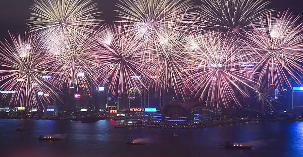 Fireworks explode over Victoria Harbour to celebrate the Lunar New Year in Hong Kong
