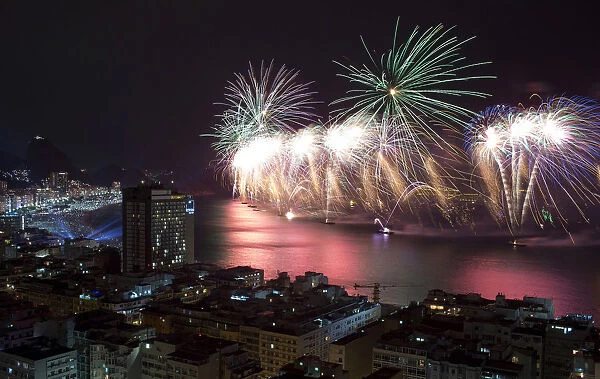 Fireworks light up the sky over Copacabana beach during New Year celebrations in Rio