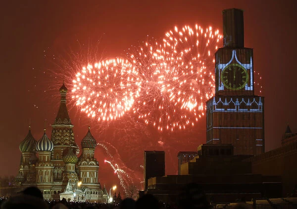 Fireworks light the sky over St. Basils Cathedral and Kremlins Spasskaya Tower
