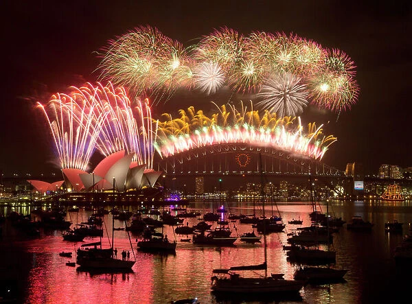 Fireworks light up the Sydney Harbour Bridge during the annual fireworks display to