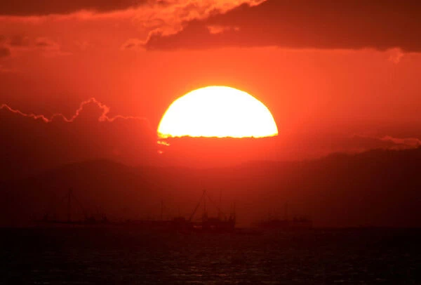 Fishing boats are pictured during sunset at a Manila Bay in Pasay