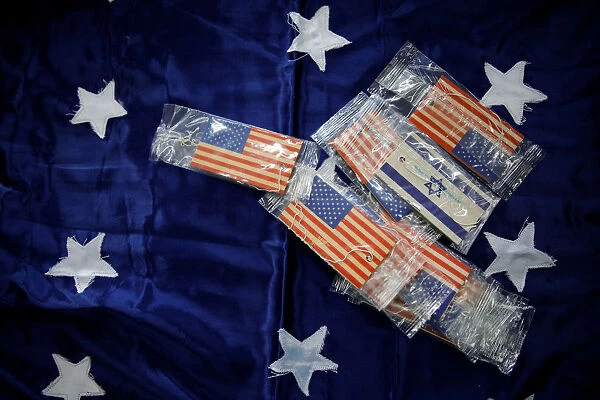 Flags of the United States and Israel are seen printed on car fresheners at a workshop