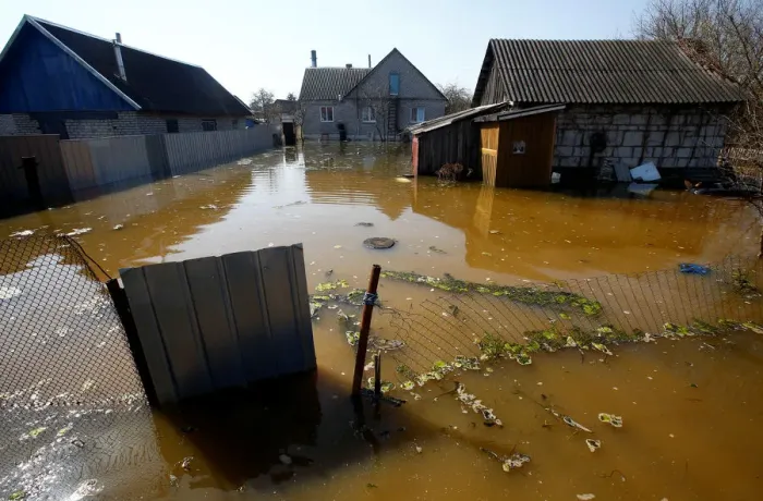 Framed Print : A flooded courtyard is seen as water from the Neman river overflows its banks during Framed Print : A flooded courtyard is seen as water from the Neman river overflows its banks during