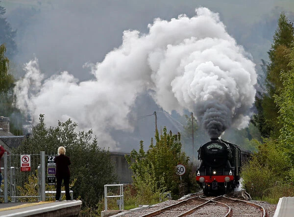 The Flying Scotsman steam train passes through Pitlochry, Scotland