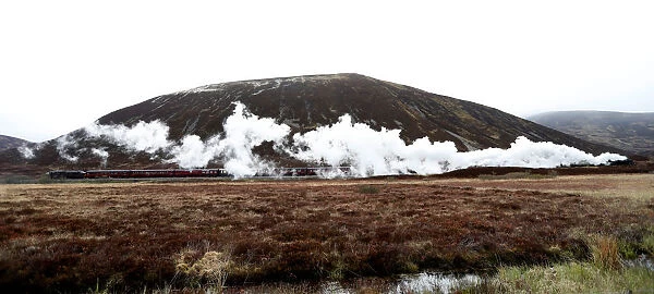 The Flying Scotsman steam train travels north through the Drumochter Pass, Scotland