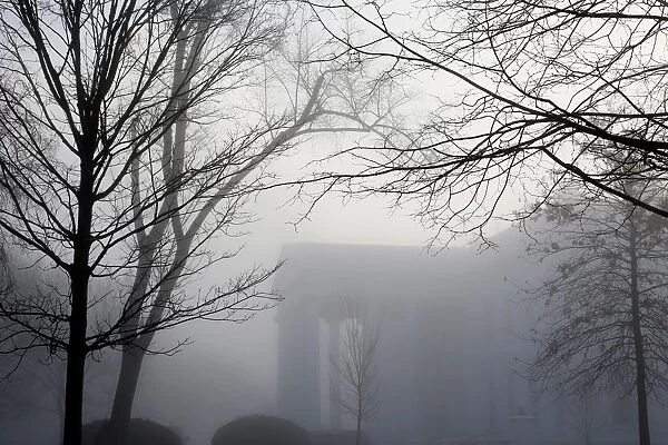 Fog partially shrouds the White House in Washington