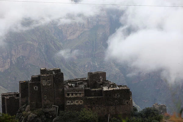Fog rises above a village in the mountainous district of Haraz