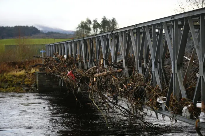 Framed Print : A footbridge lies littered with debris following flooding at Newton Stewart in Scotland Framed Print : A footbridge lies littered with debris following flooding at Newton Stewart in Scotland